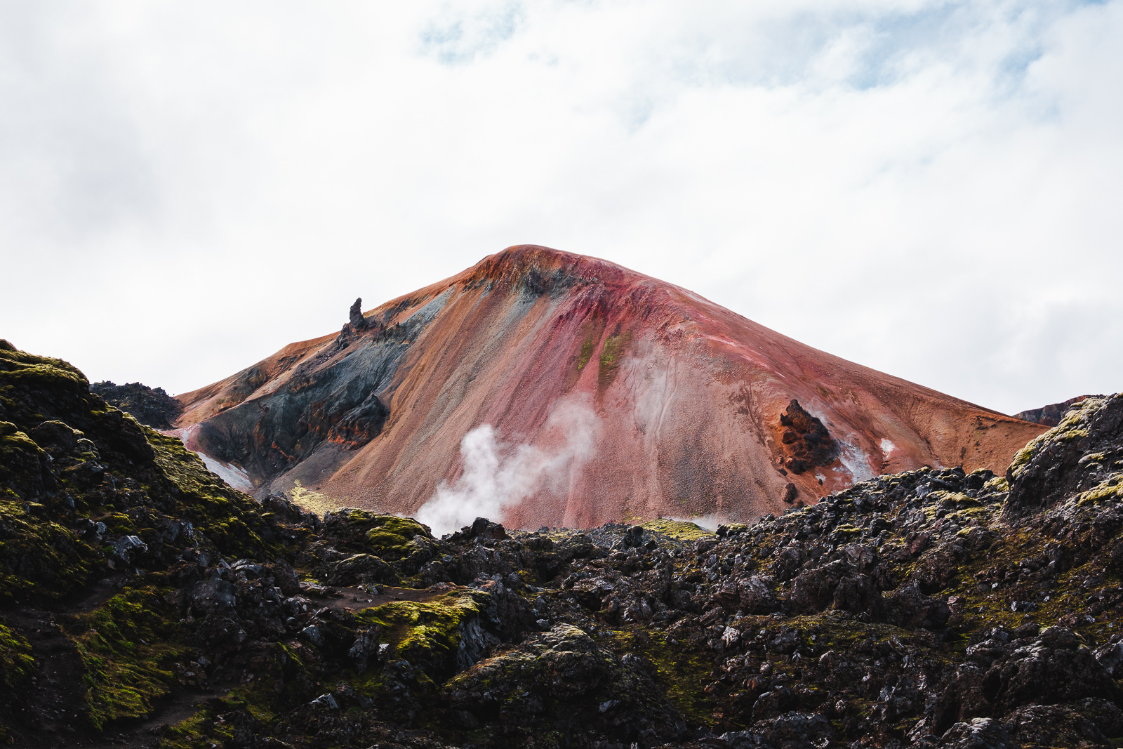 Close-up of Landmannalaugar’s colorful peaks doing their best impression of a giant surrealist painting.