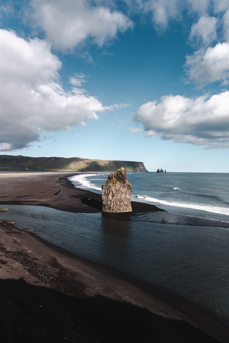 Dramatic skies, black sand, sea stacks – Reynisfjara beach looking straight out of a Viking saga.