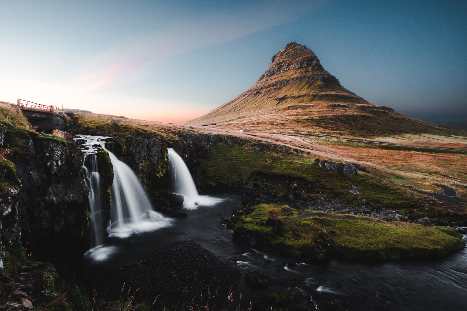 Kirkjufell and its twin waterfalls bathed in soft sunset light. Iceland’s most photogenic mountain, and she knows it.