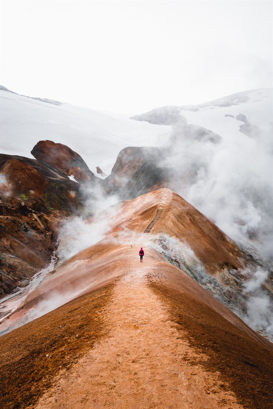 One brave soul ventures into the steaming slopes of Hveradalir, where the trails are steep, the air smells like sulfur, and the views scream 