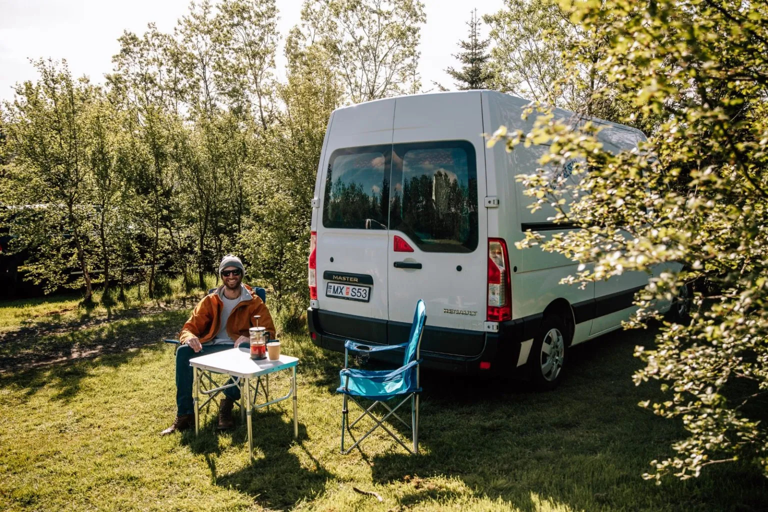 Campervan setup in Iceland with outdoor table, where simple breaks turn into full experiences.
