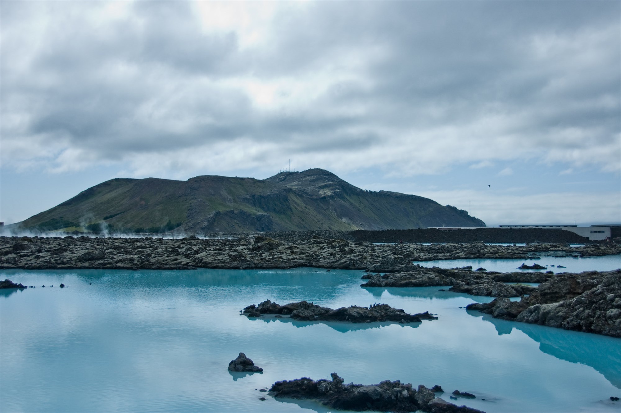 Blue Lagoon in Iceland with mountains on the background