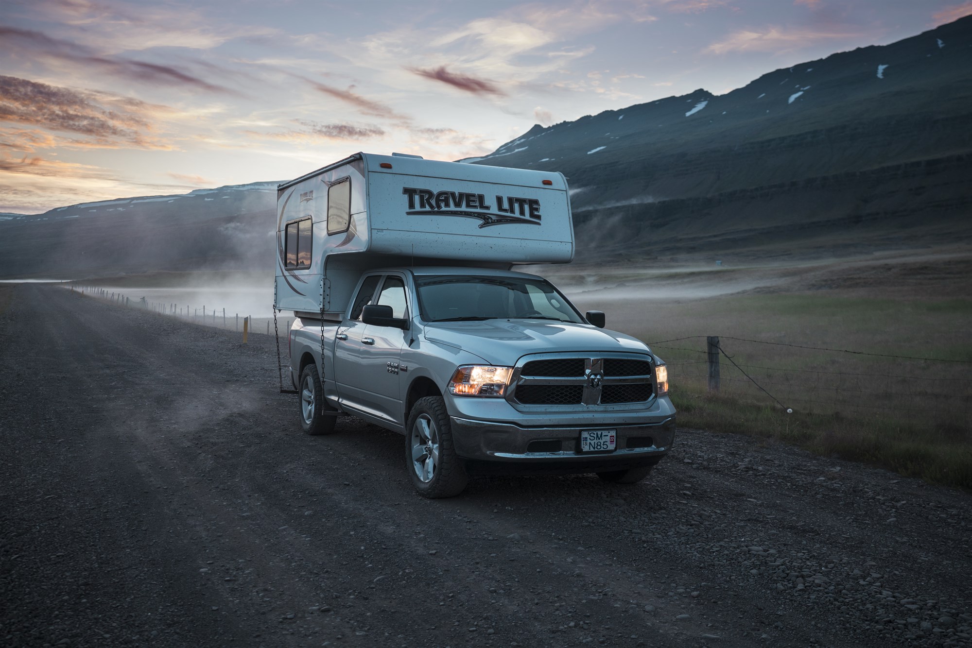 A campervan driving through Iceland’s remote landscapes, perfect for an unforgettable road trip adventure
