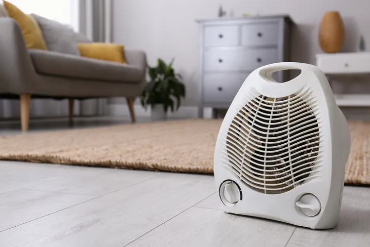 Portable heater used indoors during cold weather, similar to the heating systems travelers look for during campervan trips in Iceland.