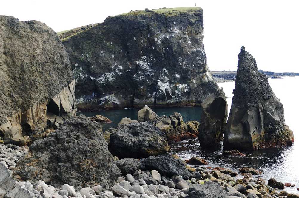 Icelandic cliff on the coast, rocks