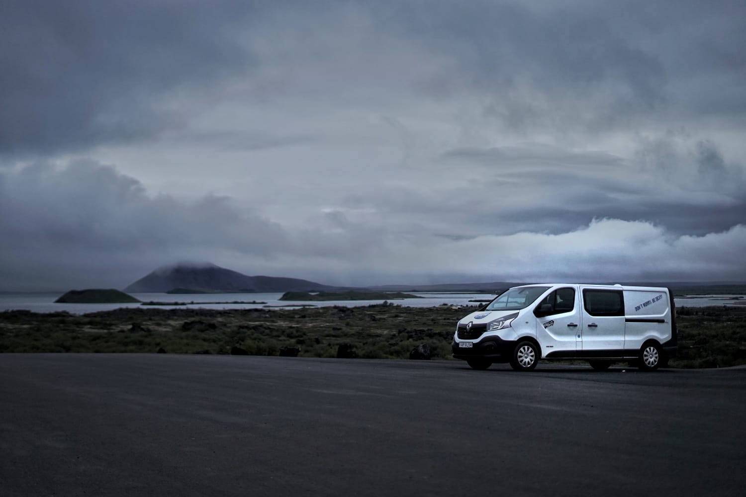 Campervan with a lake in the background