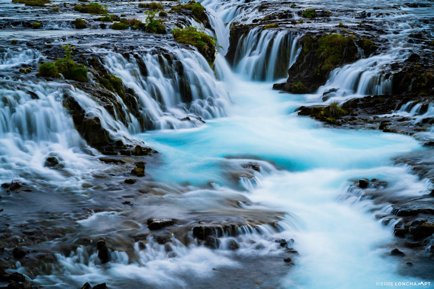 The baby-blue waters of Bruárfoss waterfall, a must-see highlight on any road trip through Iceland’s Golden Circle