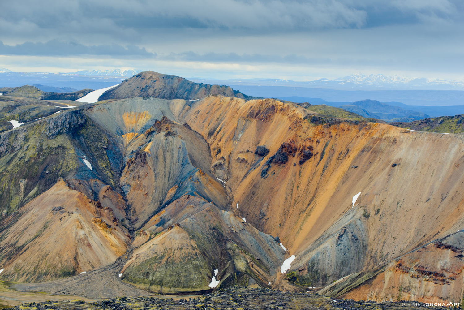 The colorful rhyolite mountains of Landmannalaugar, a top destination for hiking and adventure during an Iceland road trip.