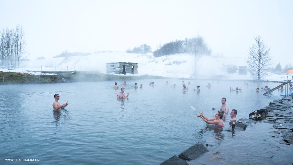 people bathing in the secret lagoon in Iceland
