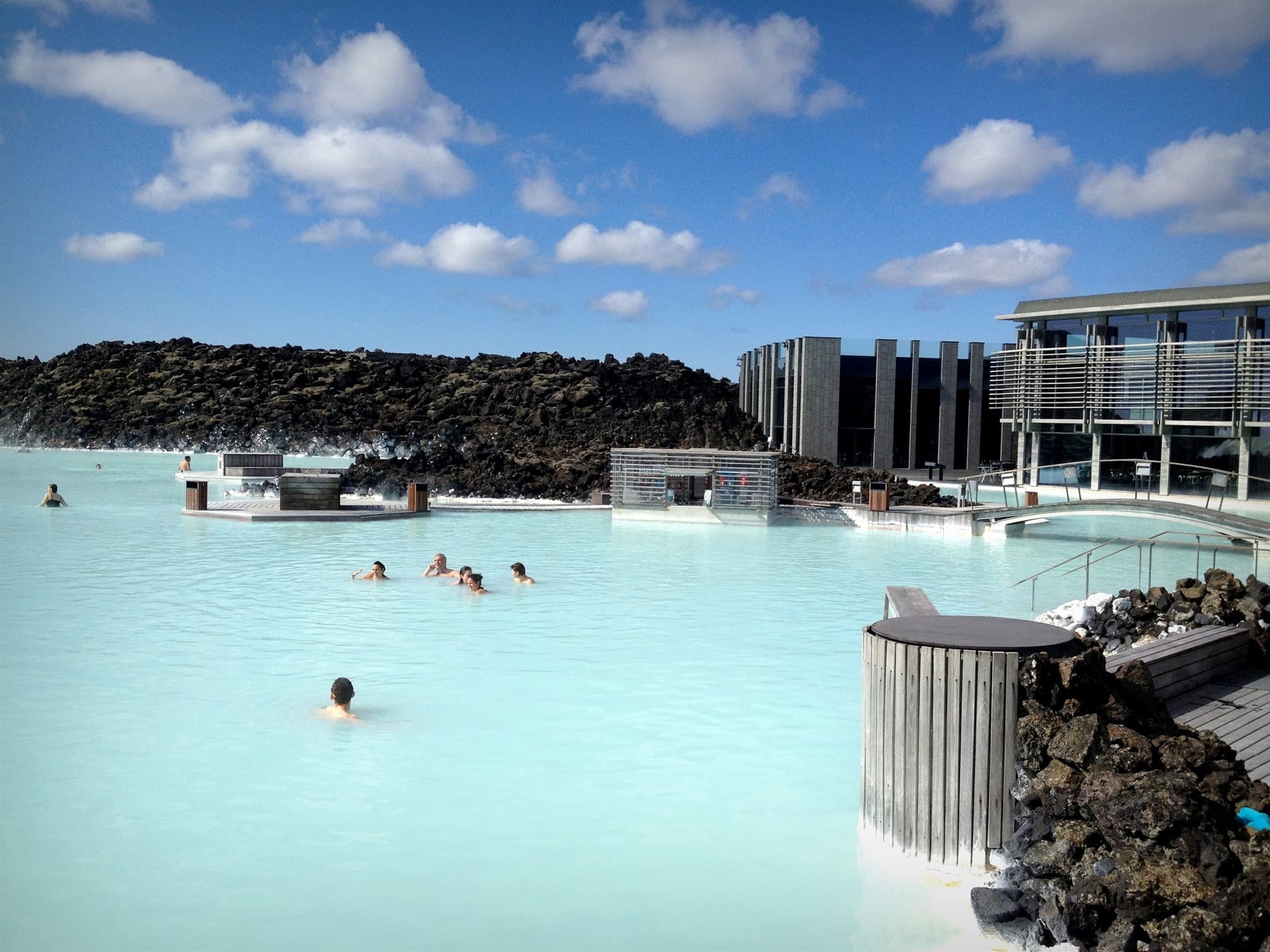Blue Lagon in the afternoon - Iceland people enjoying the milky blue waters of blue lagoon in a sunny afternon