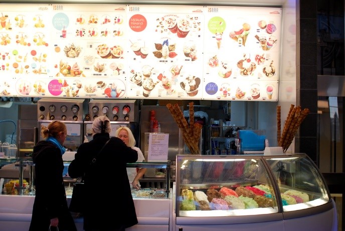 people bying ice cream at an ice cream shop in reykjavik